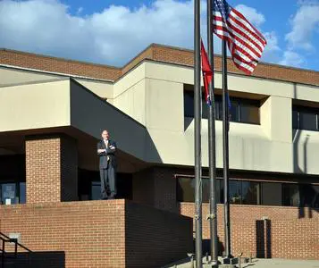 Man standing in front of a government building.